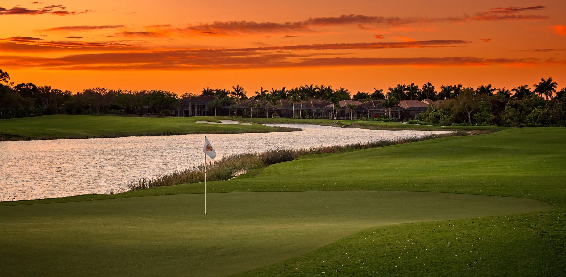 Golf hole at sunset at West Bay Club.