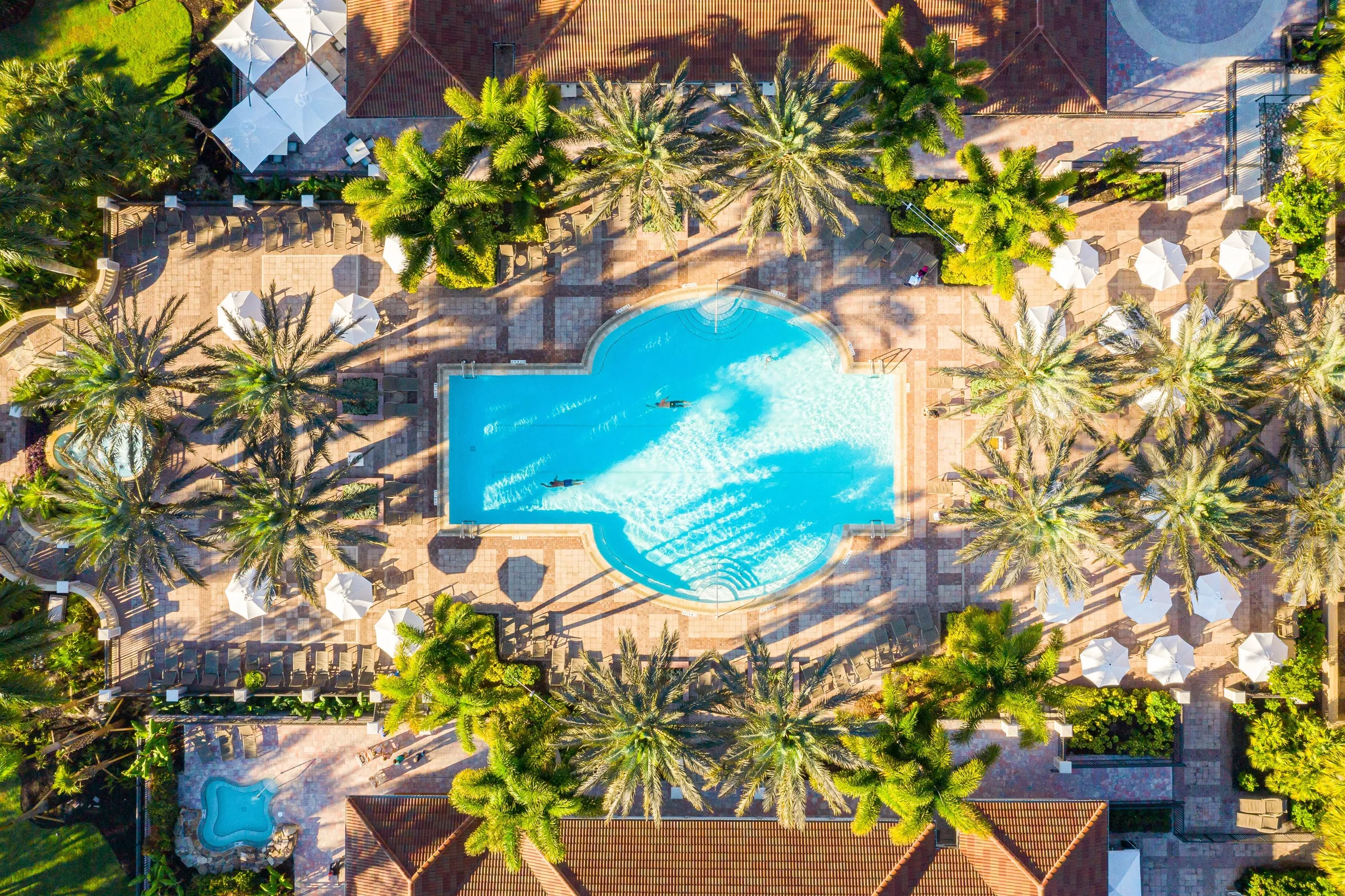 Aerial of the pool and cabanas at West Bay Club, Estero (official club site).