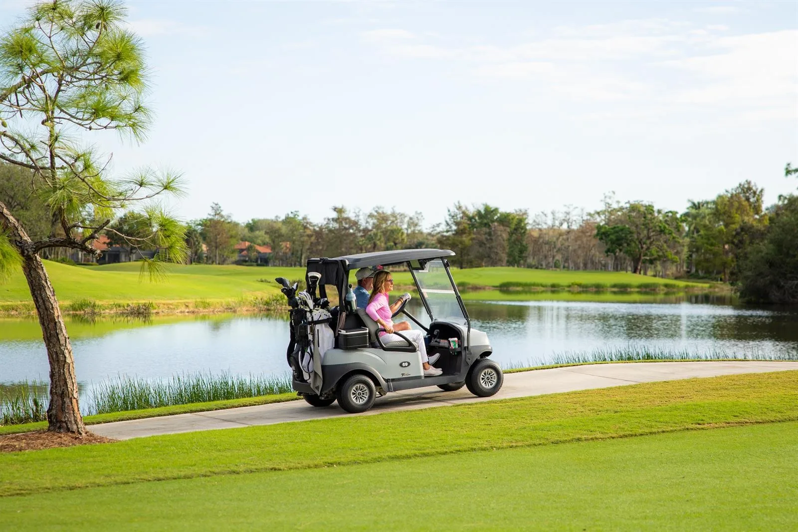 Golf cart on the course path at Wildcat Run Golf and Country Club, Estero (official).