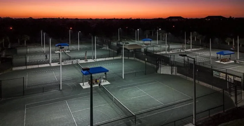 Pelican Sound tennis courts at dusk