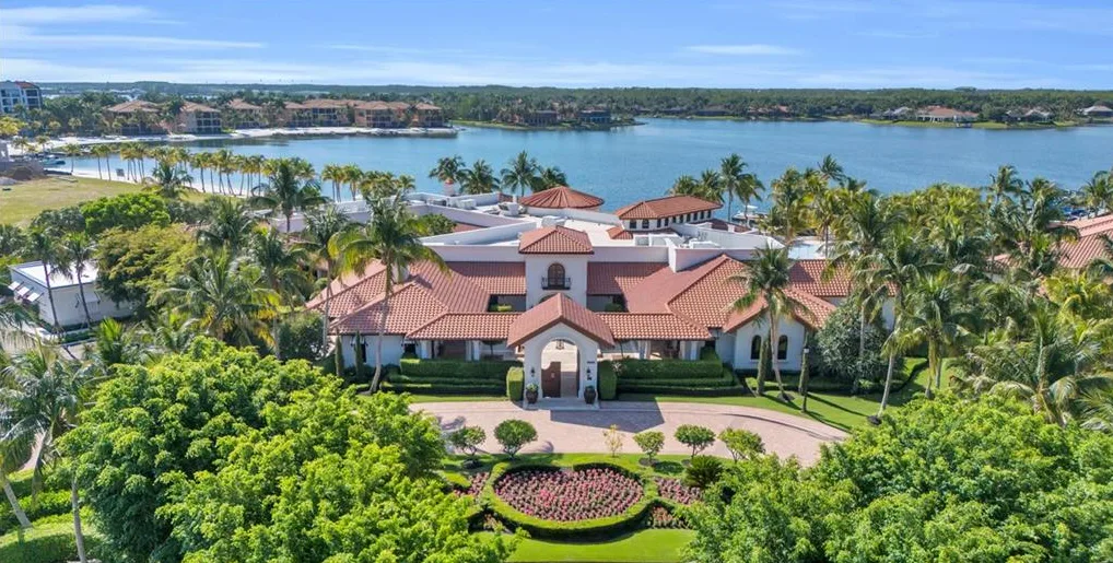 Miromar Lakes clubhouse aerial on the lake