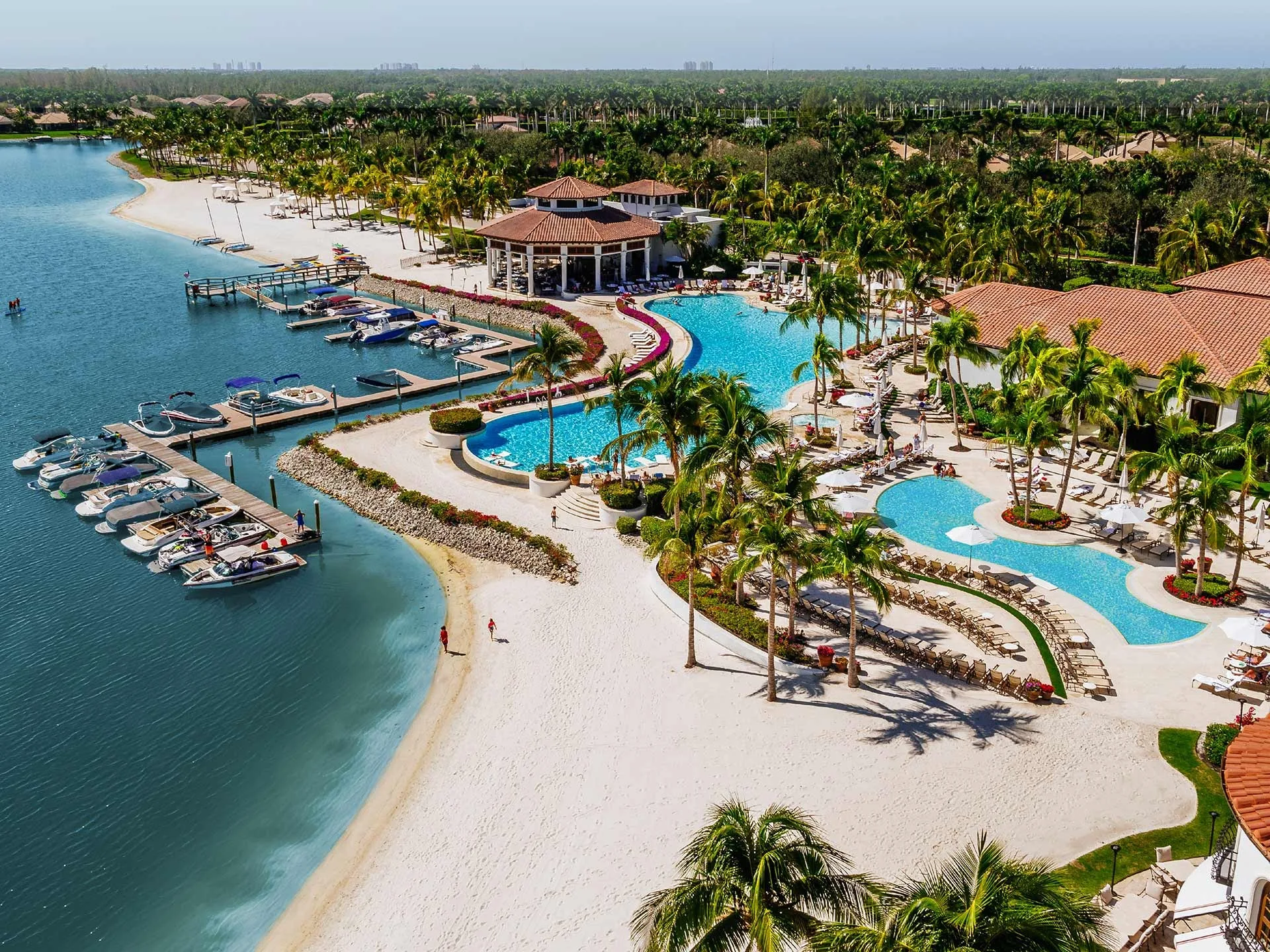 Aerial view of the beach and Beach Clubhouse on the lake.