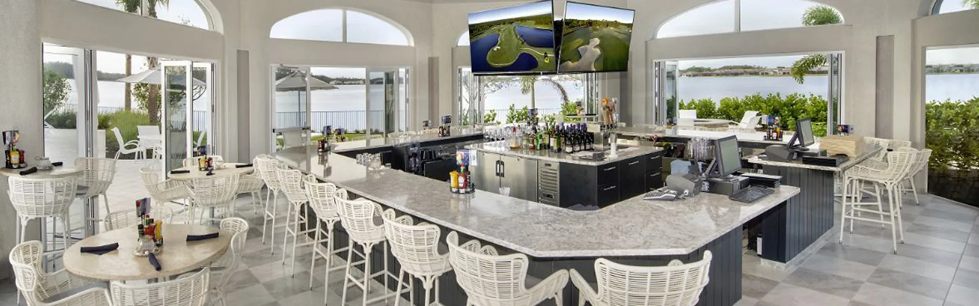 Captain's Club indoor-outdoor bar at the Corkscrew Shores clubhouse, Estero (official community site).