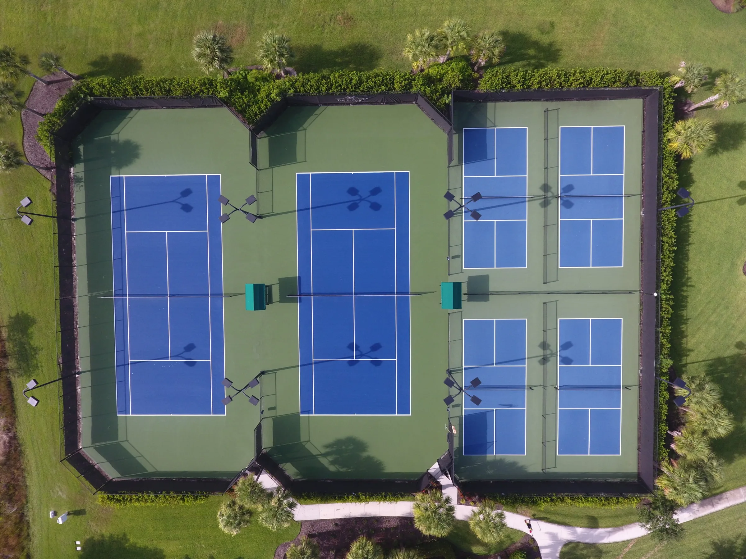 Aerial of the tennis and pickleball courts at The Preserve at Corkscrew, Estero (official HOA site).
