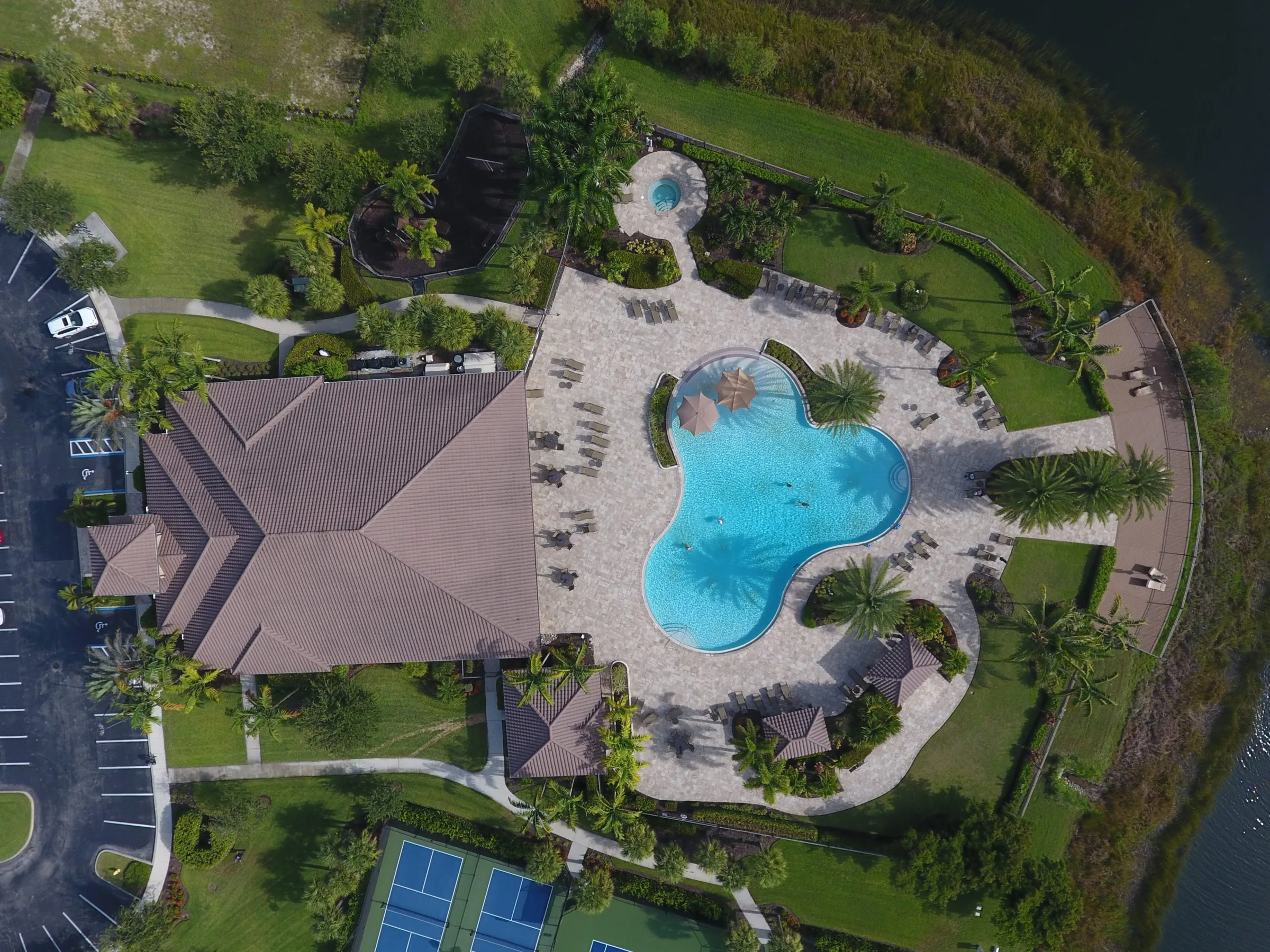 Aerial of the resort pool and clubhouse at The Preserve at Corkscrew, Estero (official HOA site).
