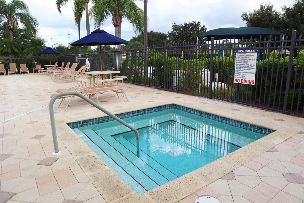 Community spa beside the pool deck at Stoneybrook, Estero (official HOA site).
