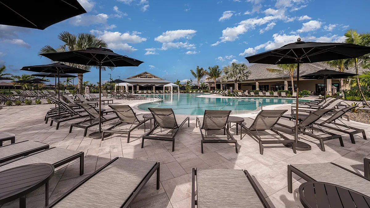 Pool deck with umbrellas and loungers at Esplanade by the Islands, Naples.