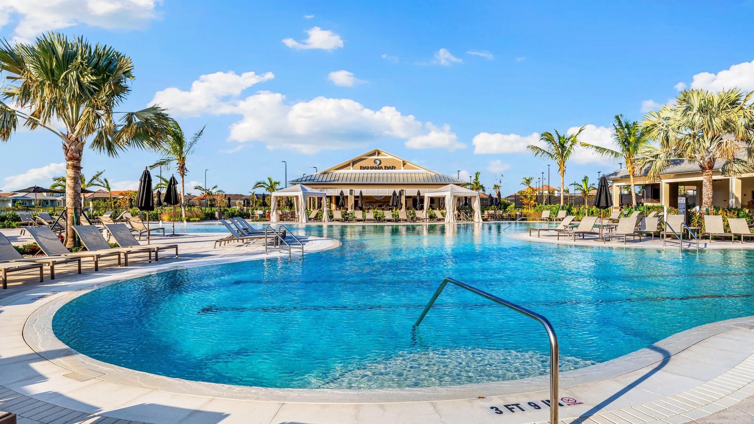 Resort pool and Bahama Bar pavilion at Esplanade by the Islands, Naples.