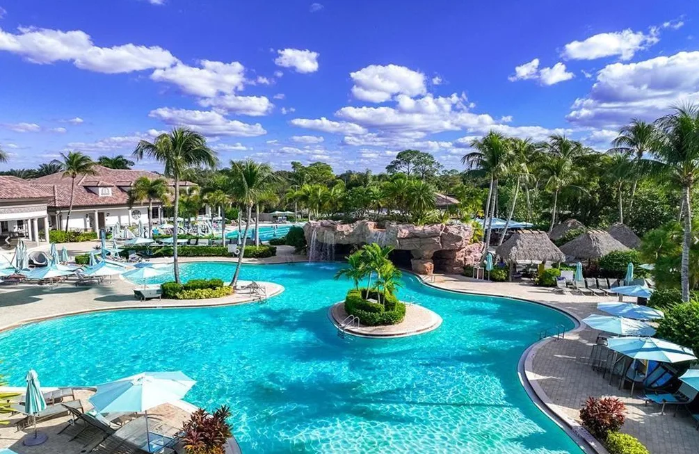 The Players Club & Spa resort pool with grotto waterfall, part of Lely Resort's optional club membership