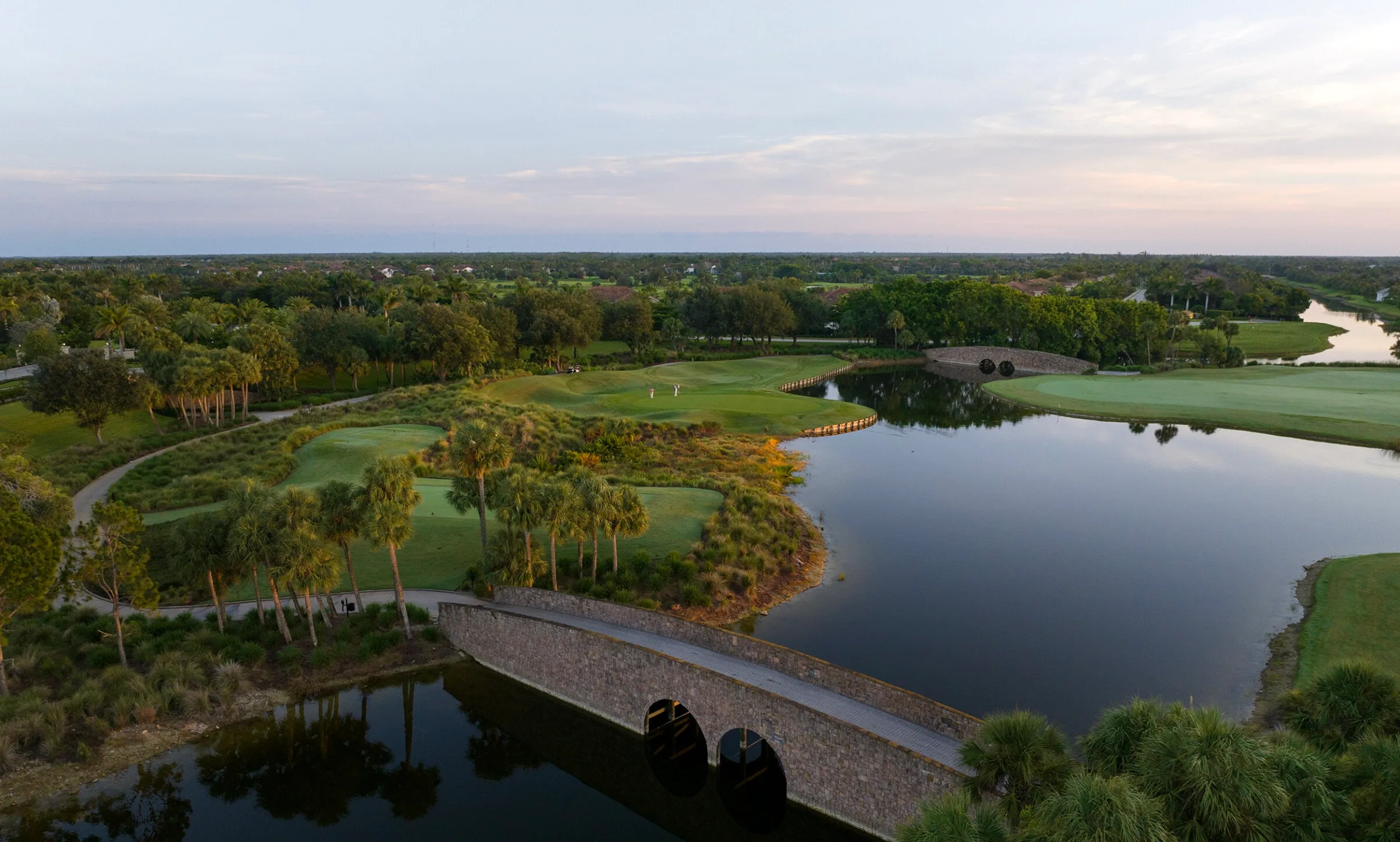 Aerial view of cart bridges crossing a lake on the Fiddler's Creek golf course, Naples.