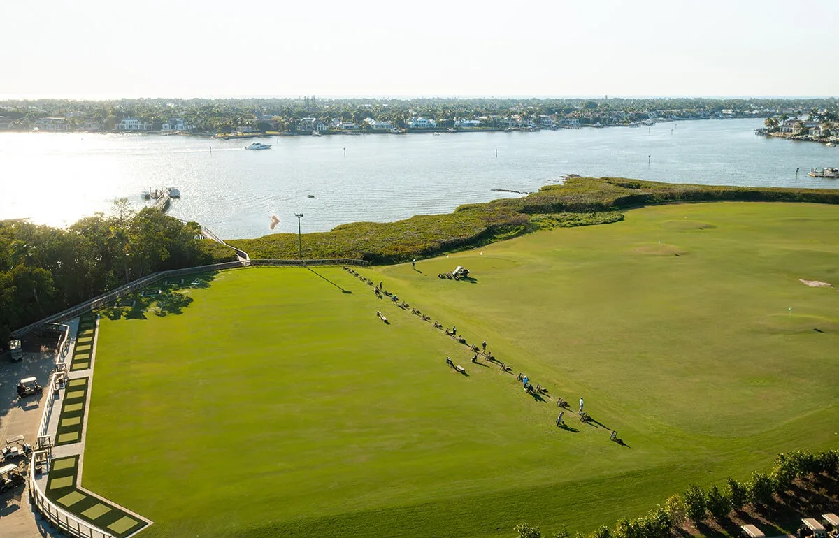 Waterfront practice range along Naples Bay at Windstar (official club site).