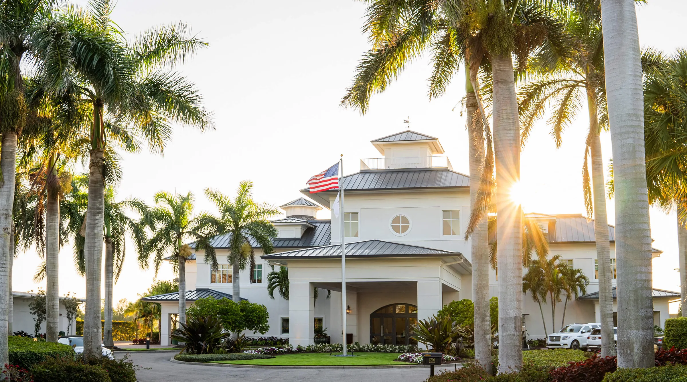 Clubhouse entrance framed by palms at Windstar on Naples Bay, Naples.