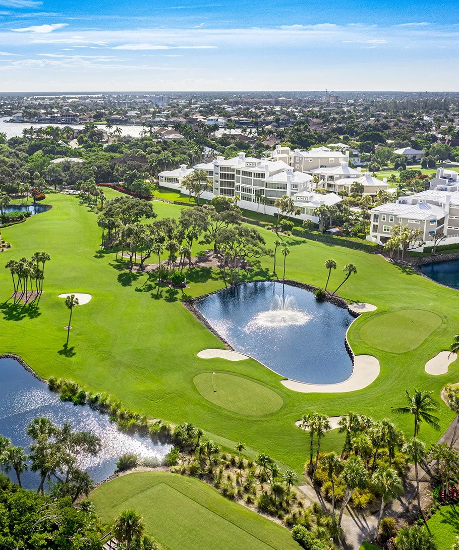 Aerial golf green bunkers and residences at Hideaway Beach Club (official).