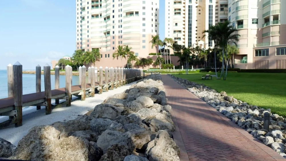 Waterfront promenade along the seawall at Cape Marco, Marco Island (official Cape Marco association sites).