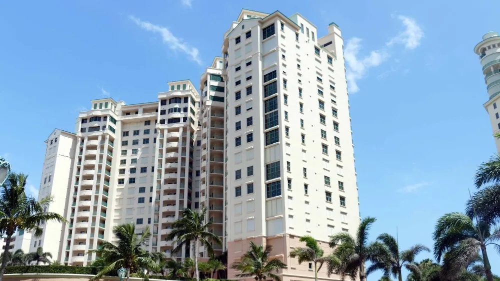 Cape Marco condominium towers among palms, Marco Island (official Cape Marco association sites).