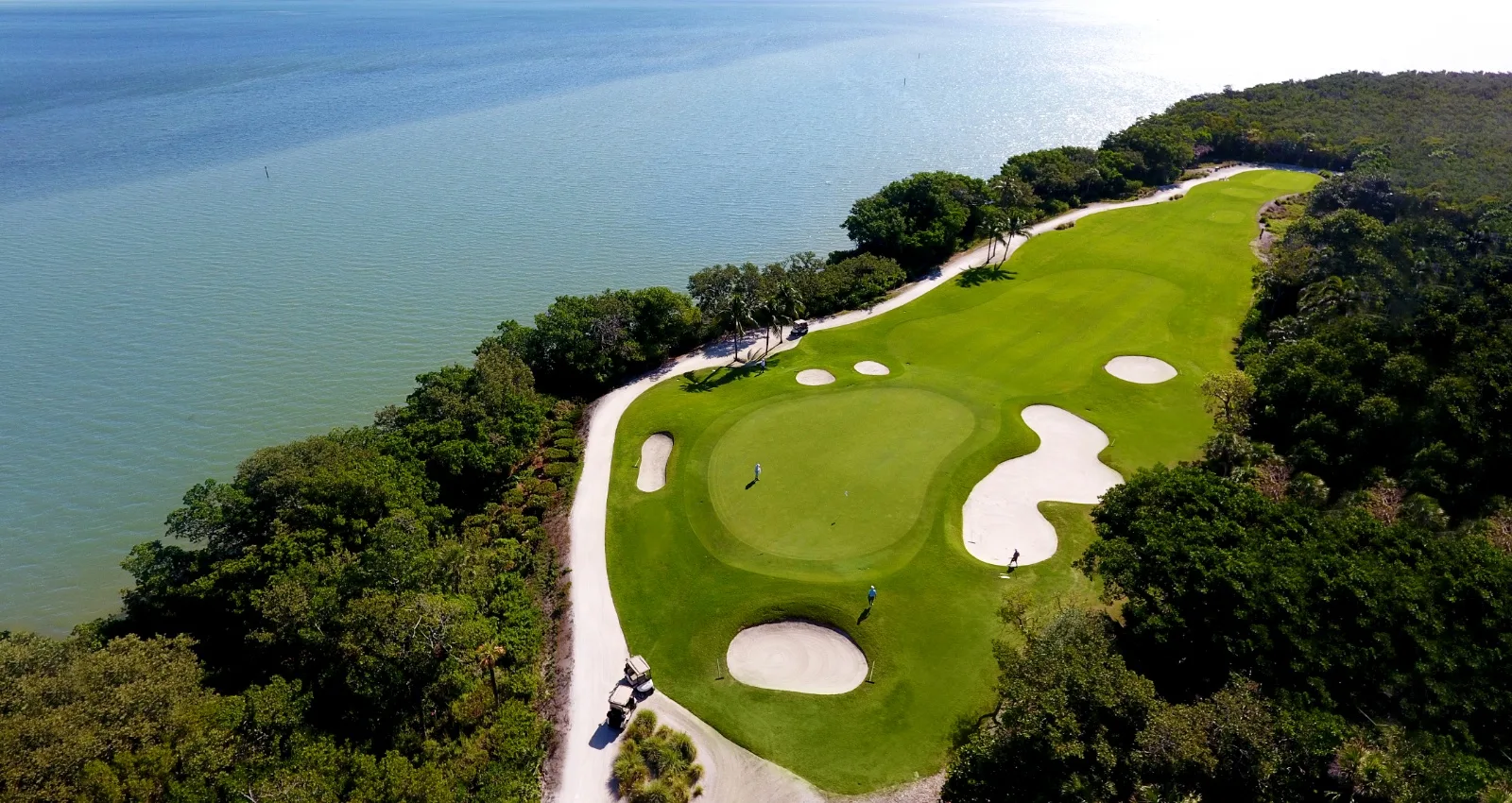 Aerial coastal golf green at The Sanctuary Golf Club, Sanibel (official).