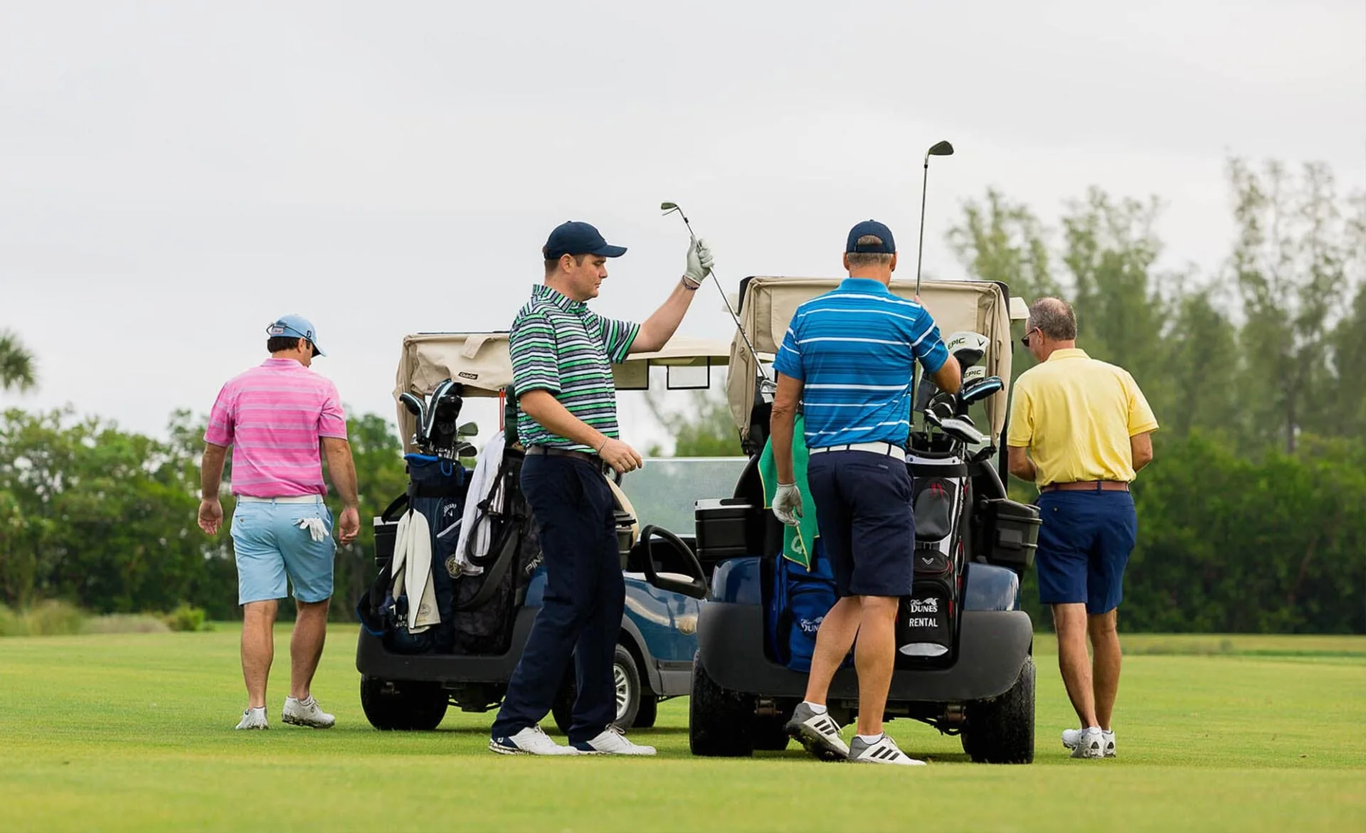 Golfers and carts on the fairway at The Dunes, Sanibel (official club site).
