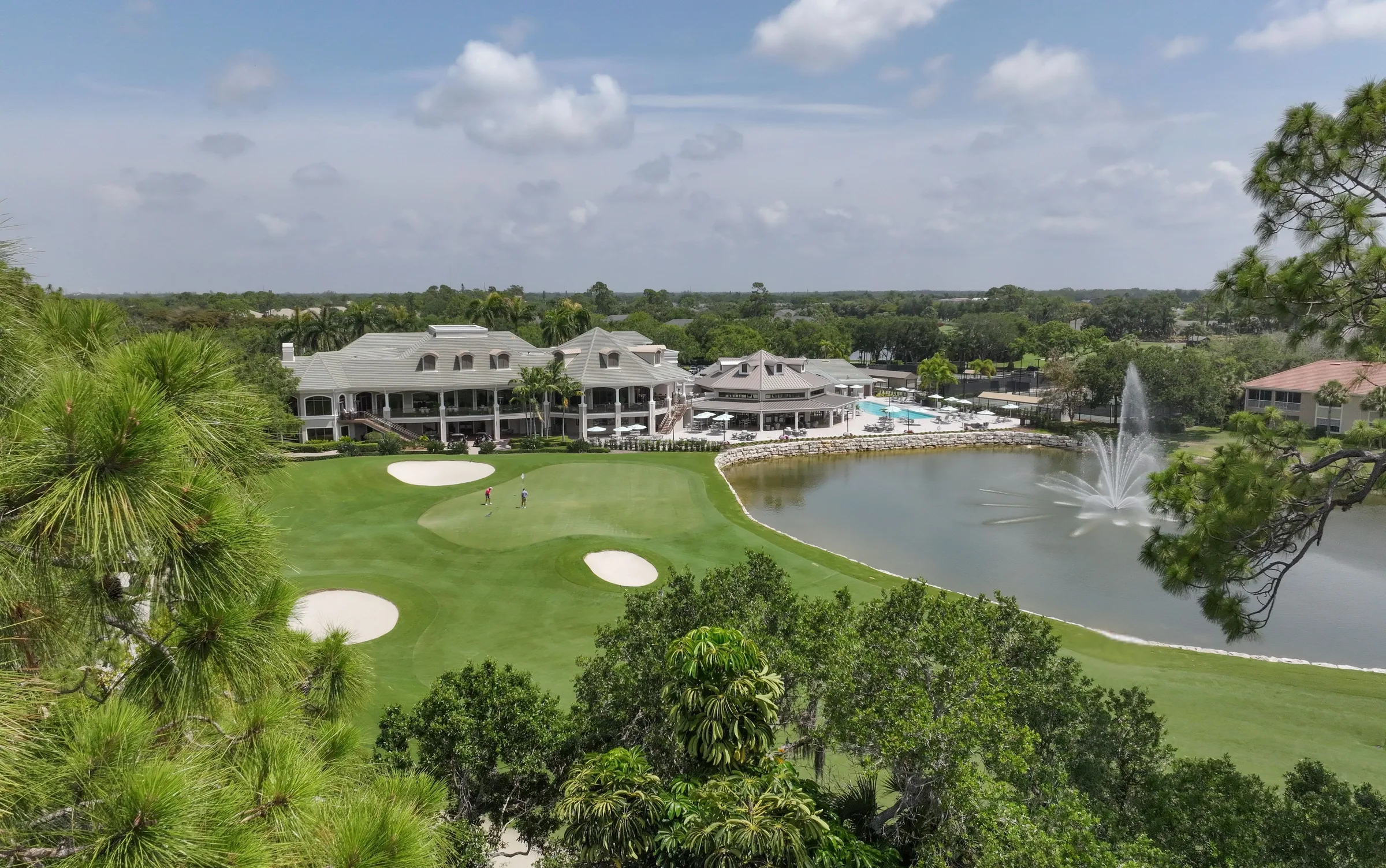 Clubhouse across the lake at Stonebridge Country Club, Naples (official club site).