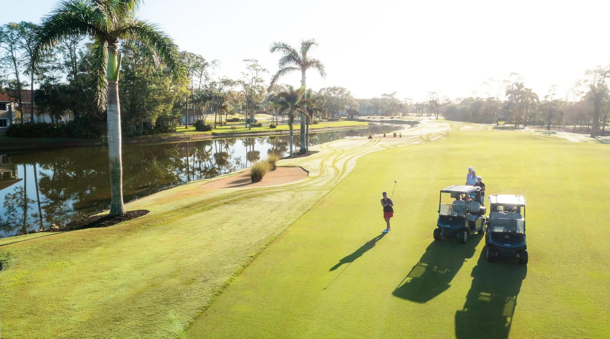 Aerial golf carts on fairway at Royal Wood Golf and Country Club (official).