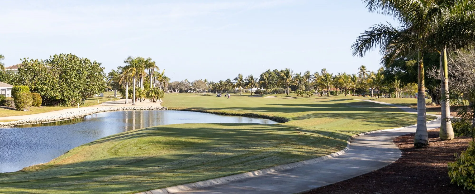 Golf course and lake landscape at Island Country Club (official club site).