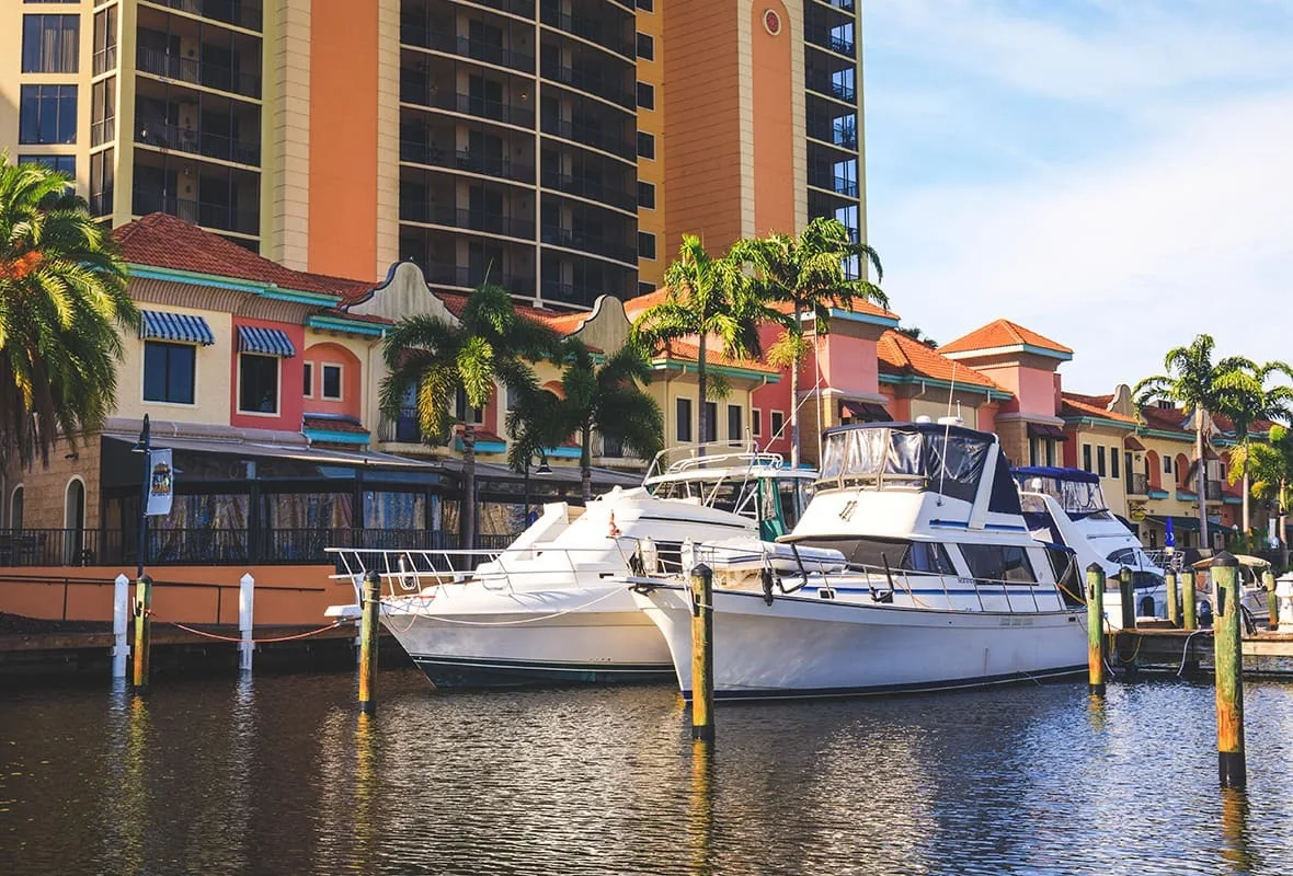 Yachts in the marina basin below the Cape Harbour condominiums, Cape Coral (official Safe Harbor Cape Harbour marina site).