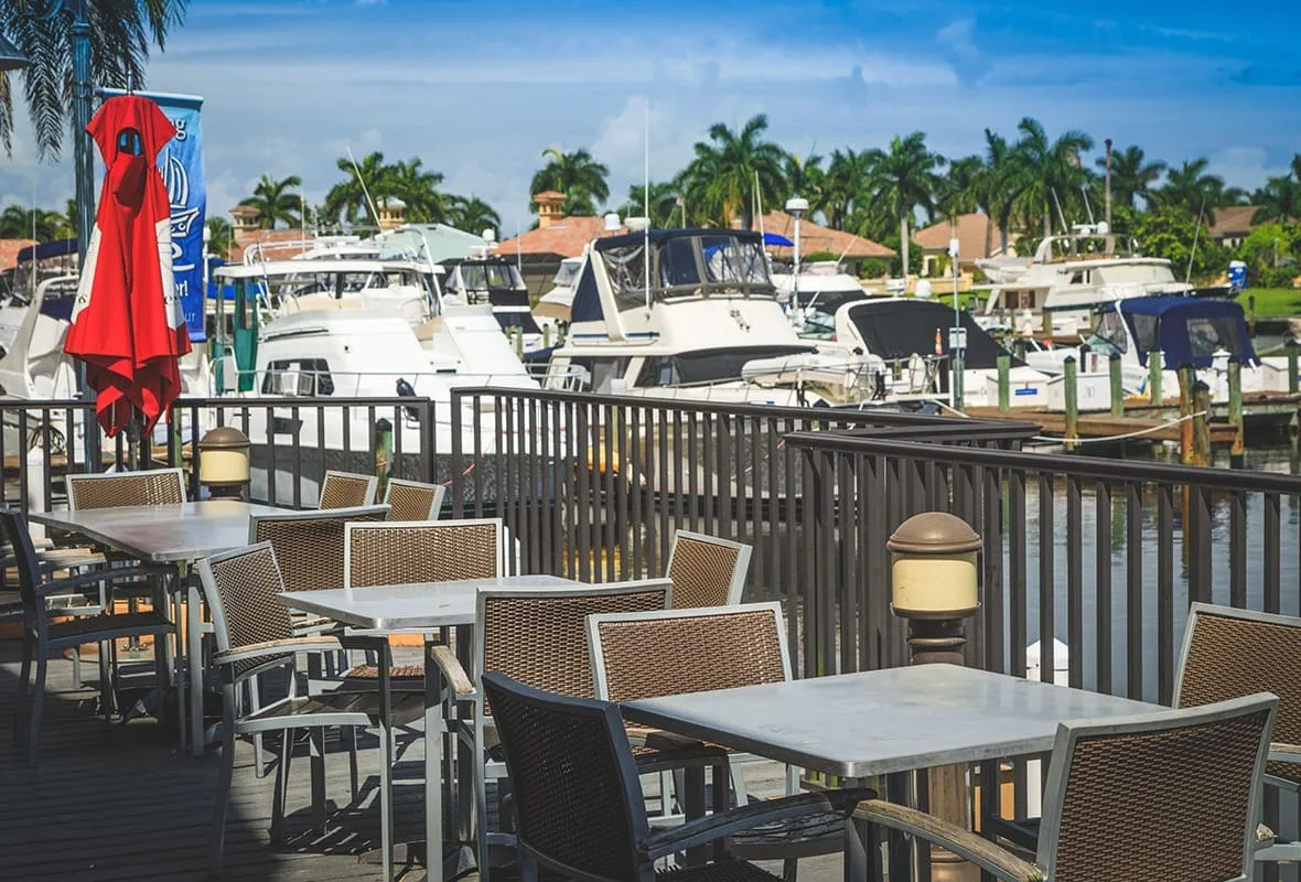 Waterfront dining deck overlooking the marina at Cape Harbour, Cape Coral (official Safe Harbor Cape Harbour marina site).