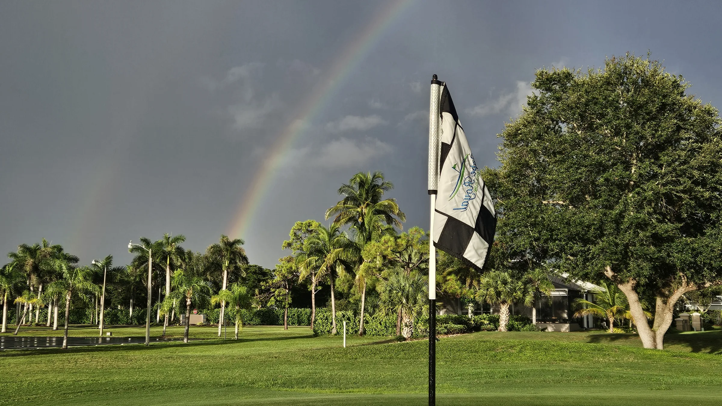 Rainbow over a green at Cape Royal Golf Club, Cape Coral (official club site).