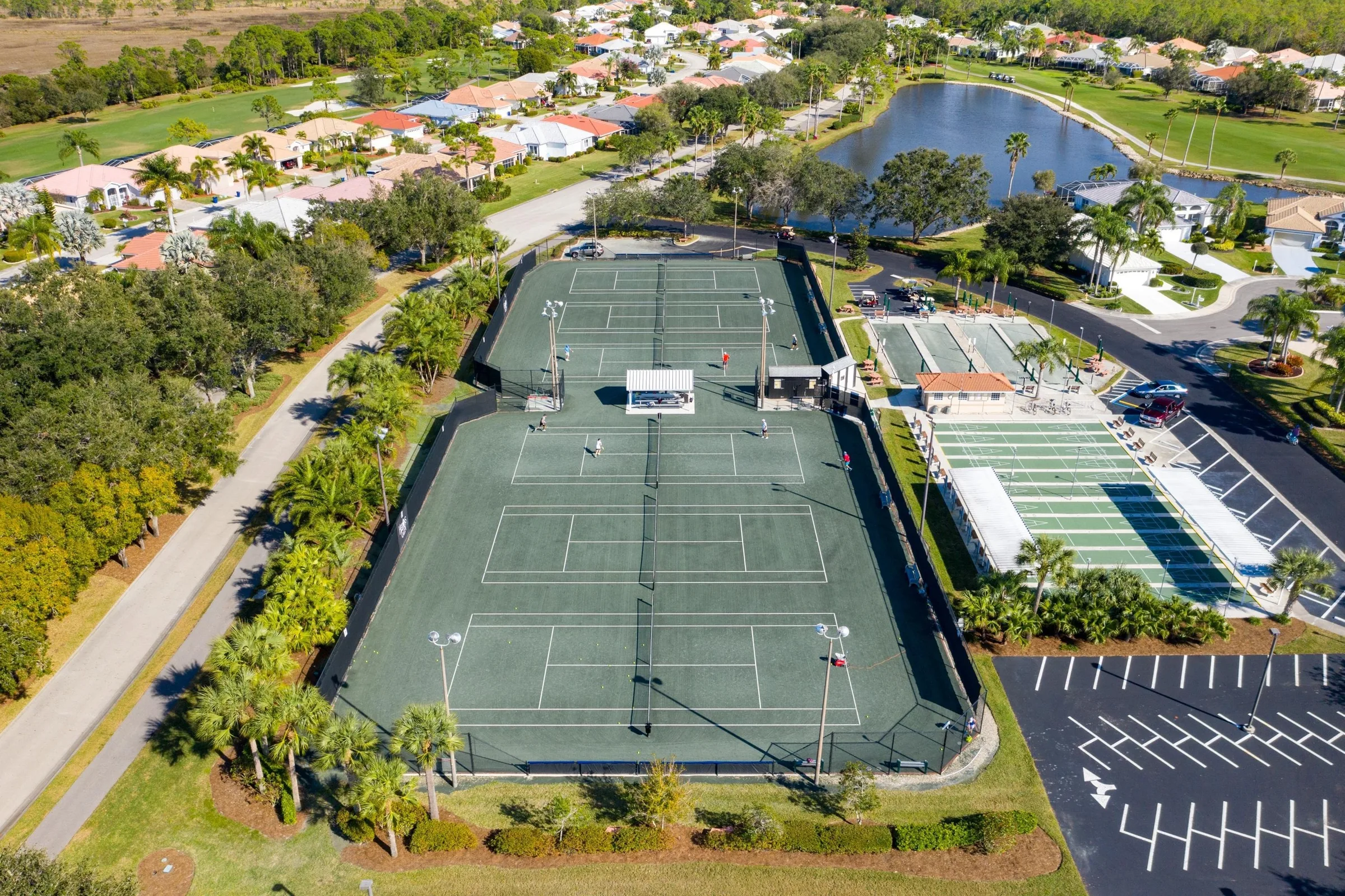 Aerial of the tennis and bocce complex at Herons Glen (official club site).