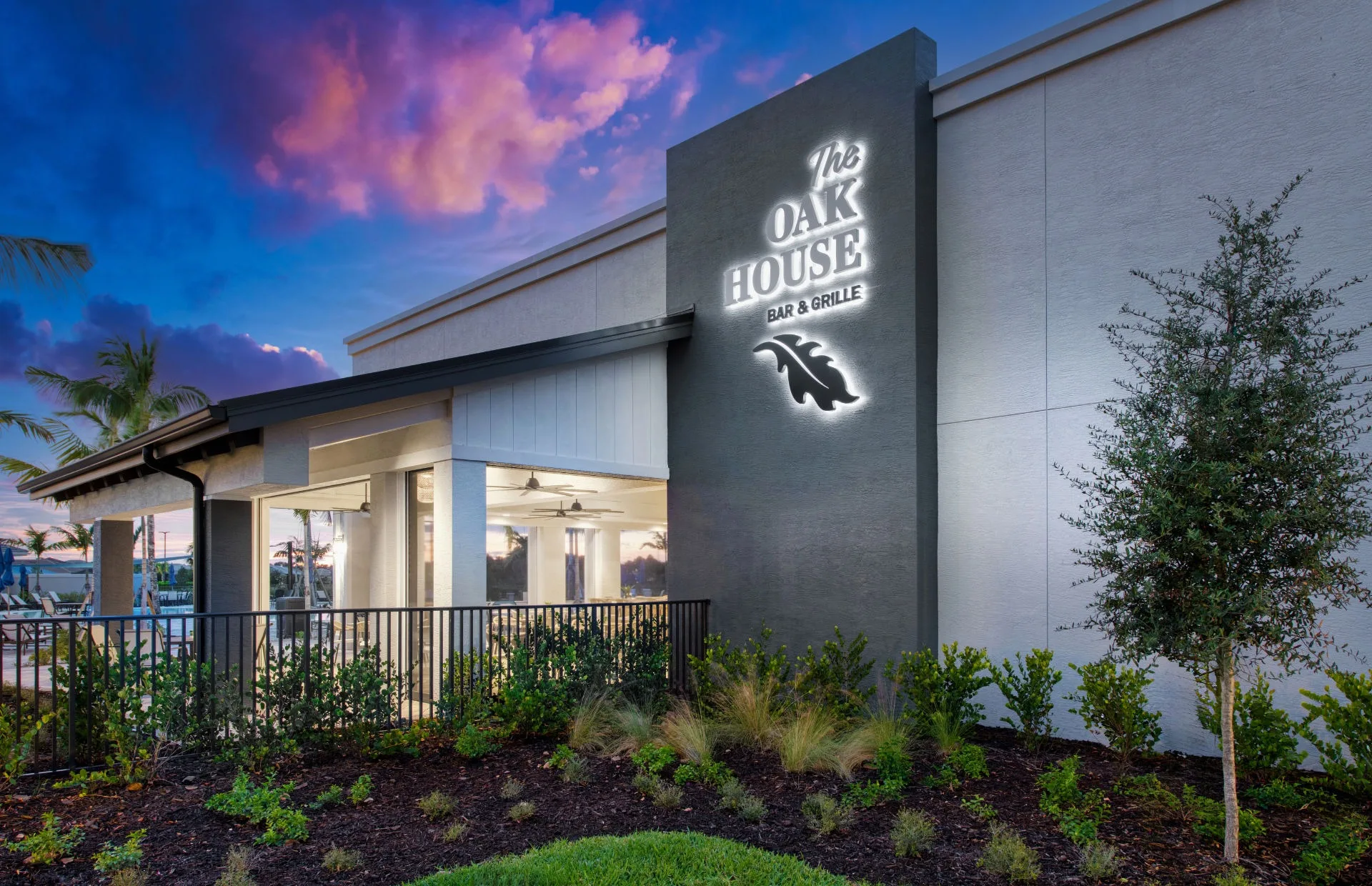 The Oak House restaurant entrance at dusk, Del Webb Oak Creek, North Fort Myers (official Del Webb site).