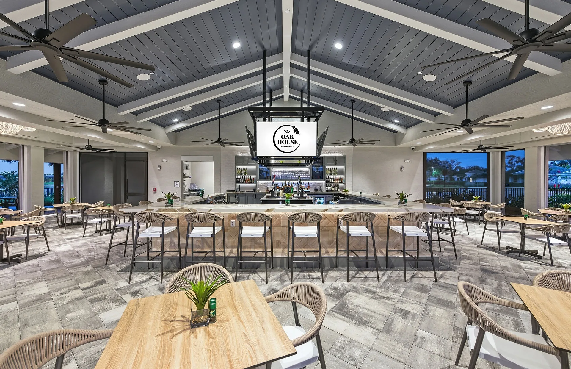 Indoor-outdoor bar and dining room at The Oak House, Del Webb Oak Creek, North Fort Myers (official Del Webb site).