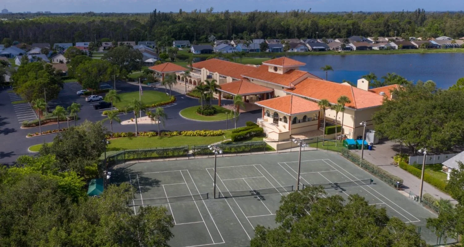 Aerial of the tennis courts and clubhouse at Sabal Springs, North Fort Myers (official HOA site).