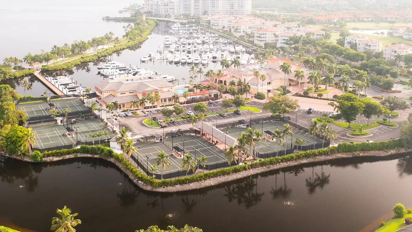 Aerial of the tennis complex and marina at Gulf Harbour, Fort Myers (official club site).