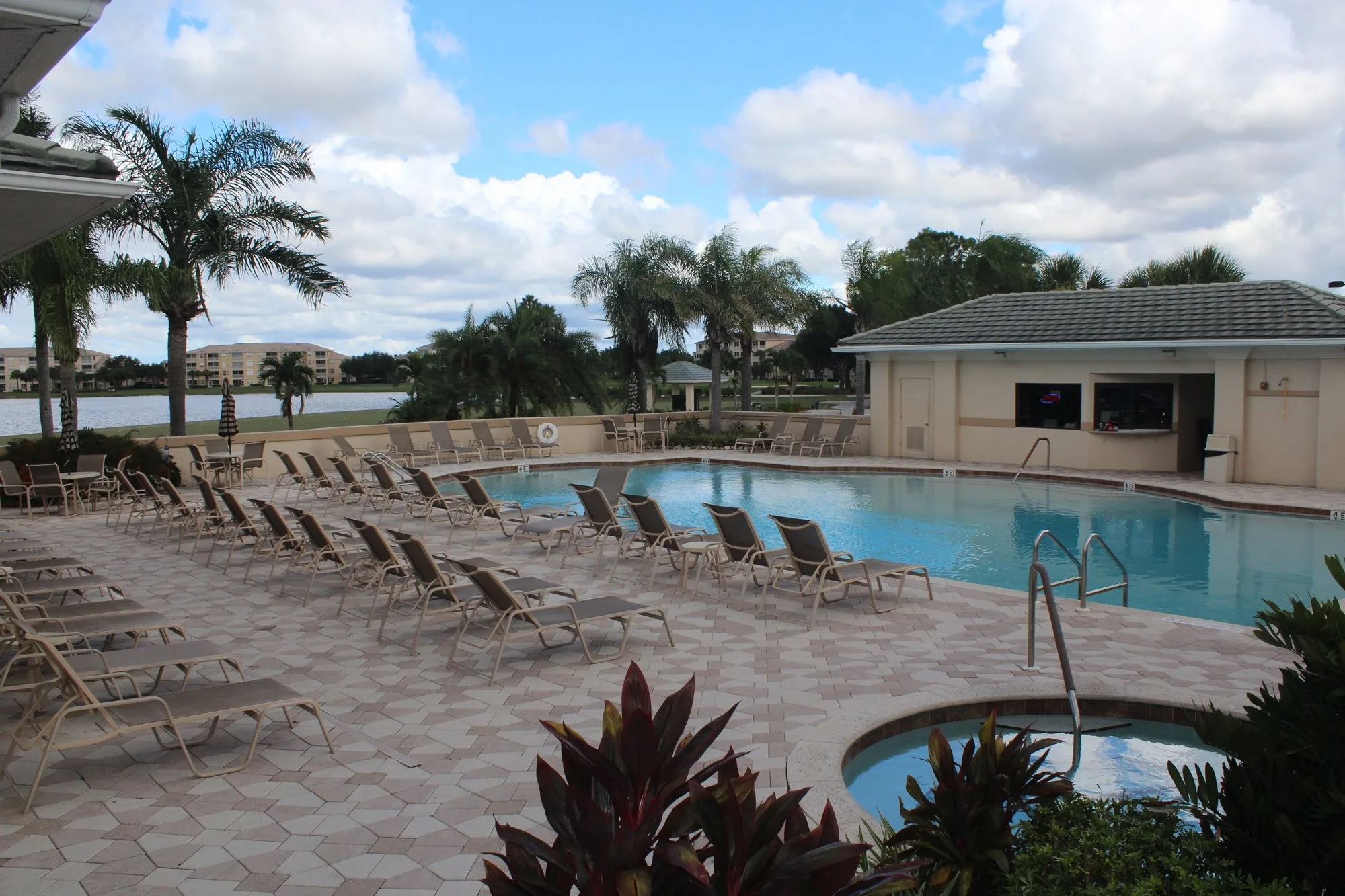 Poolside lake view at Heritage Palms Golf and Country Club (official).