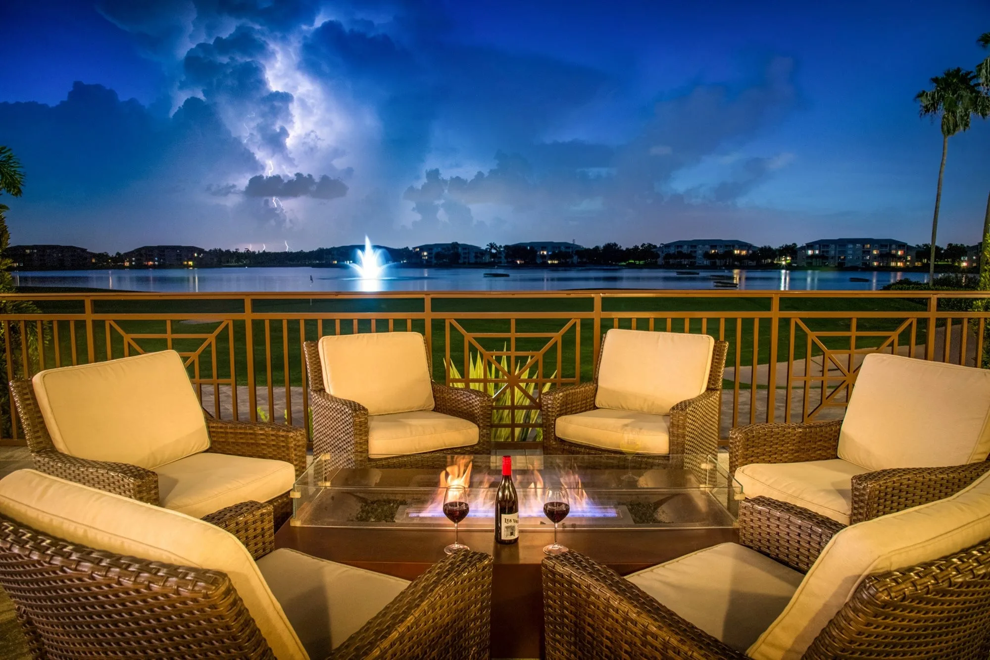 Evening fire-pit patio overlooking the lake fountain at Heritage Palms (official).