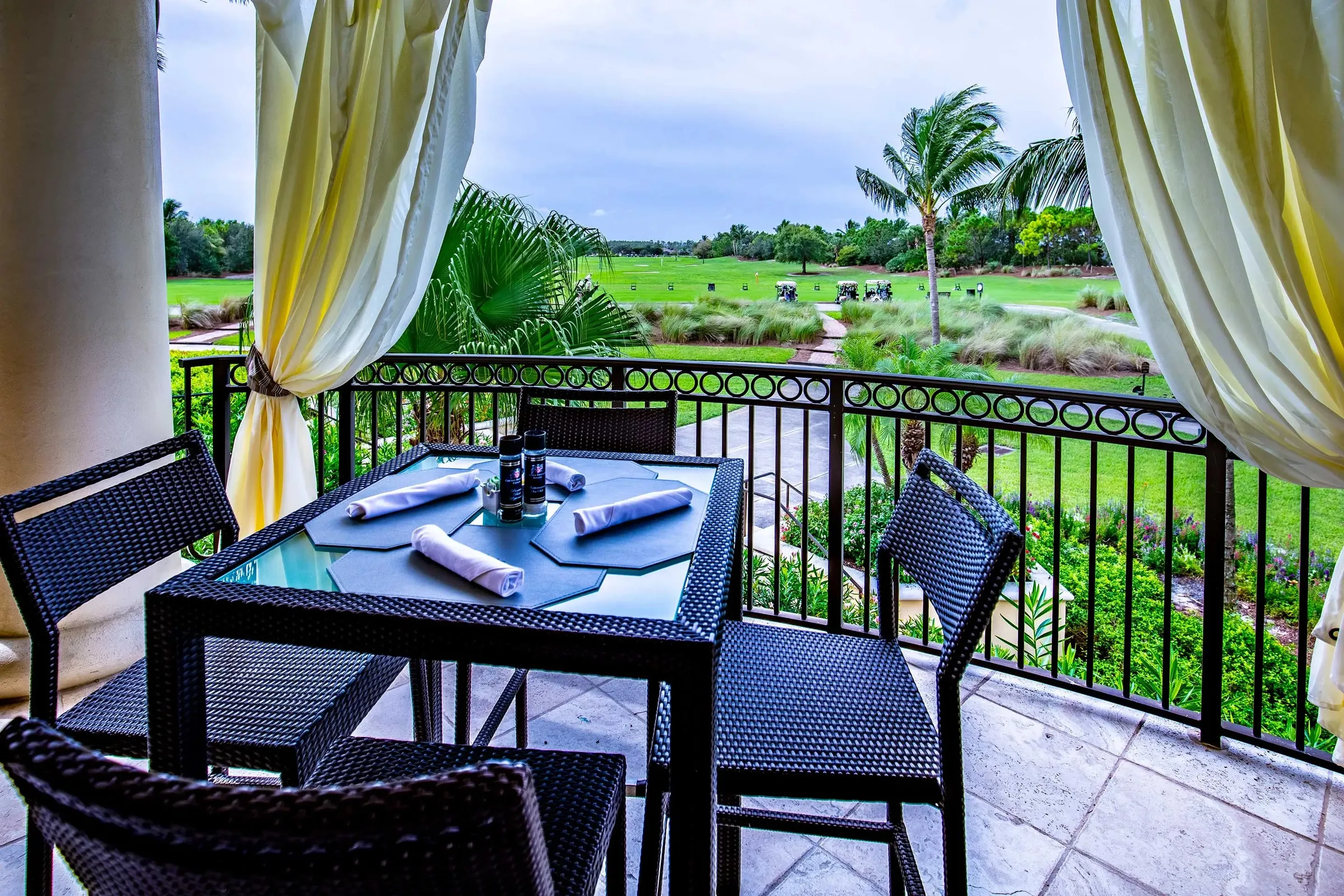 Covered dining terrace overlooking the course at The Plantation, Fort Myers (official club site).
