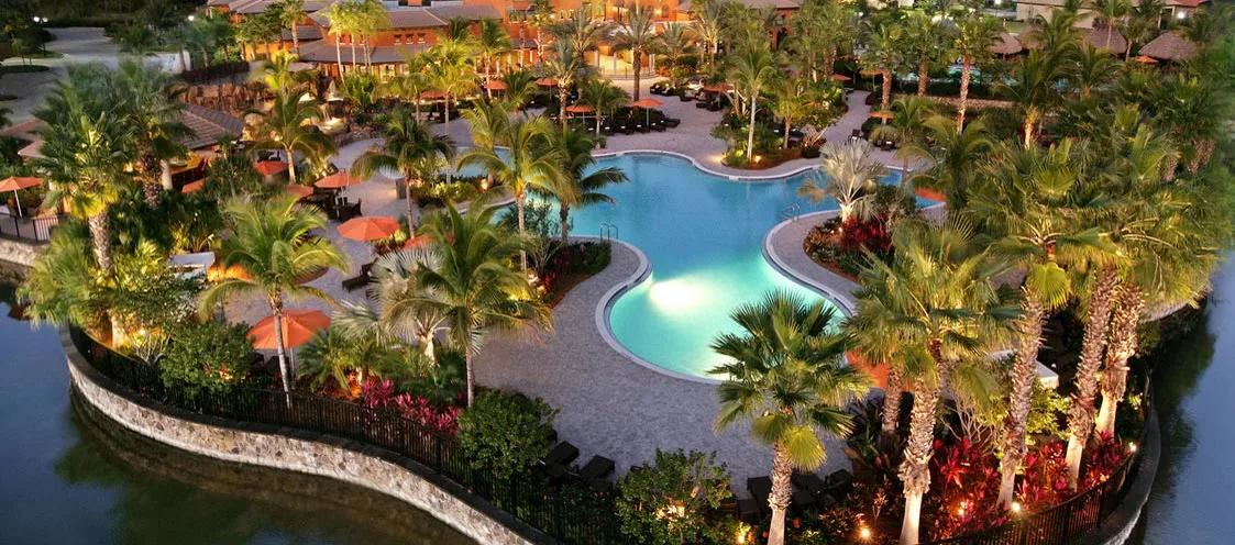 Paseo resort pool and clubhouse at dusk
