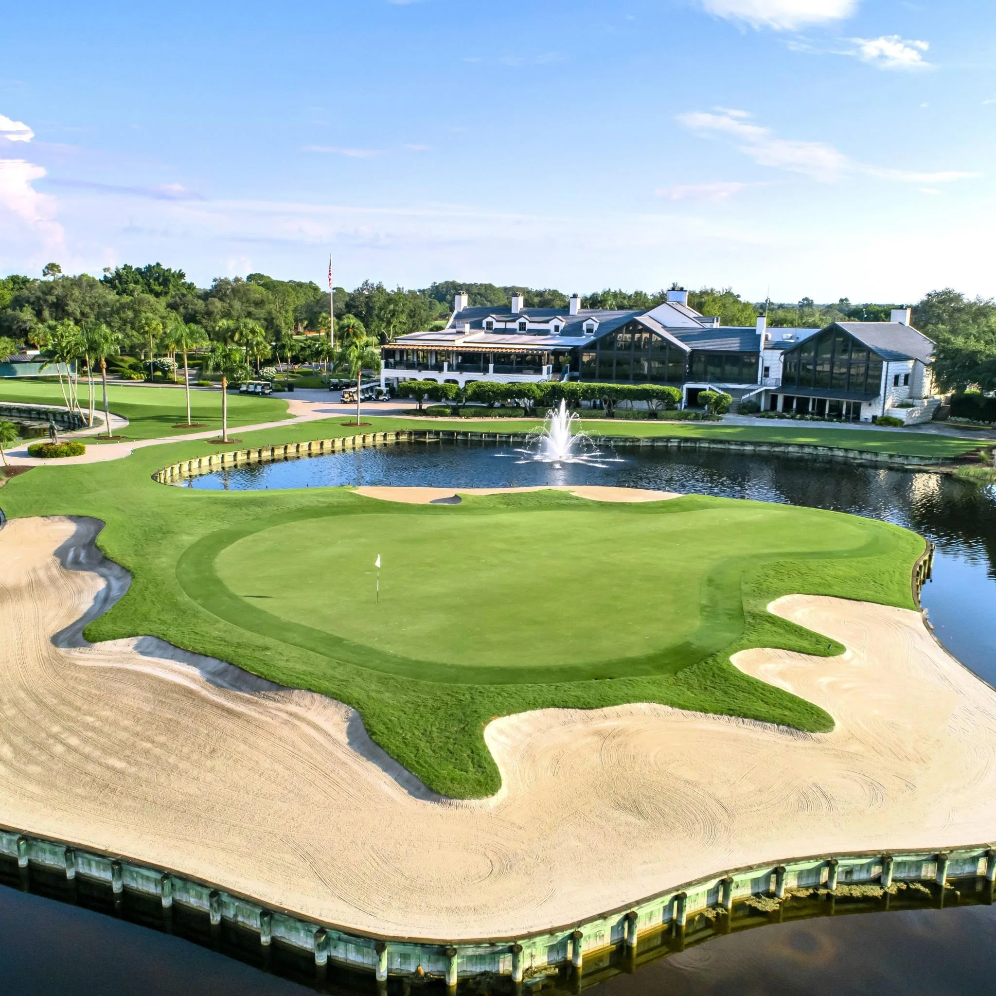 Aerial golf green surrounded by water at Fiddlesticks Country Club (official).