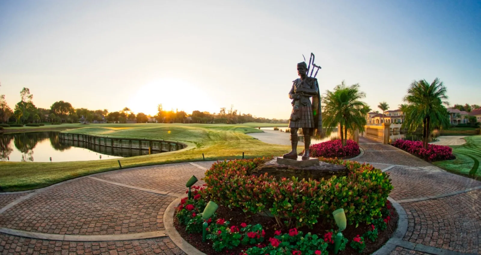 Entrance statue and golf / lake setting at Fiddlesticks Country Club (official).
