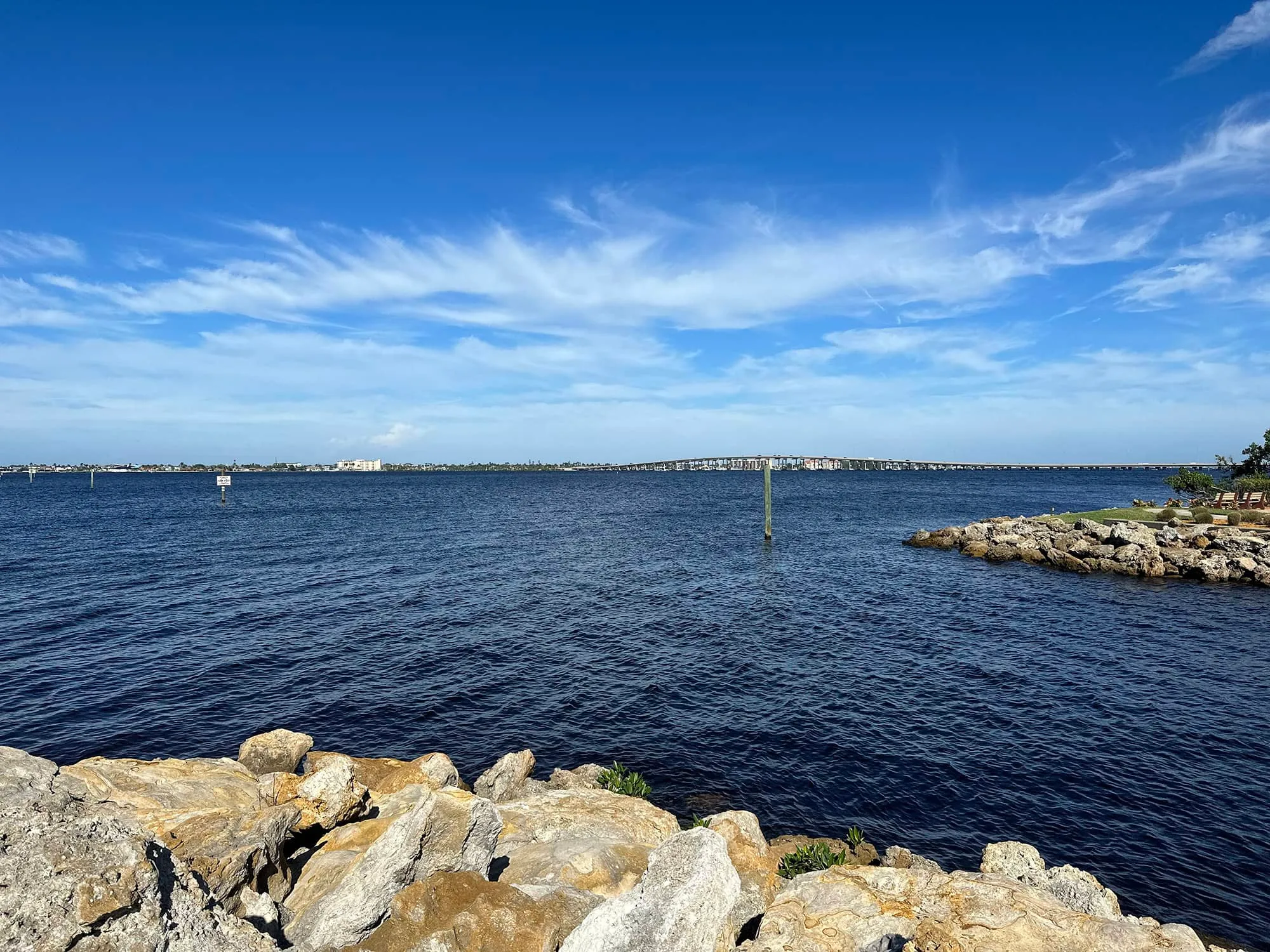 Rocky shoreline water view amenity at The Landings (official club site).