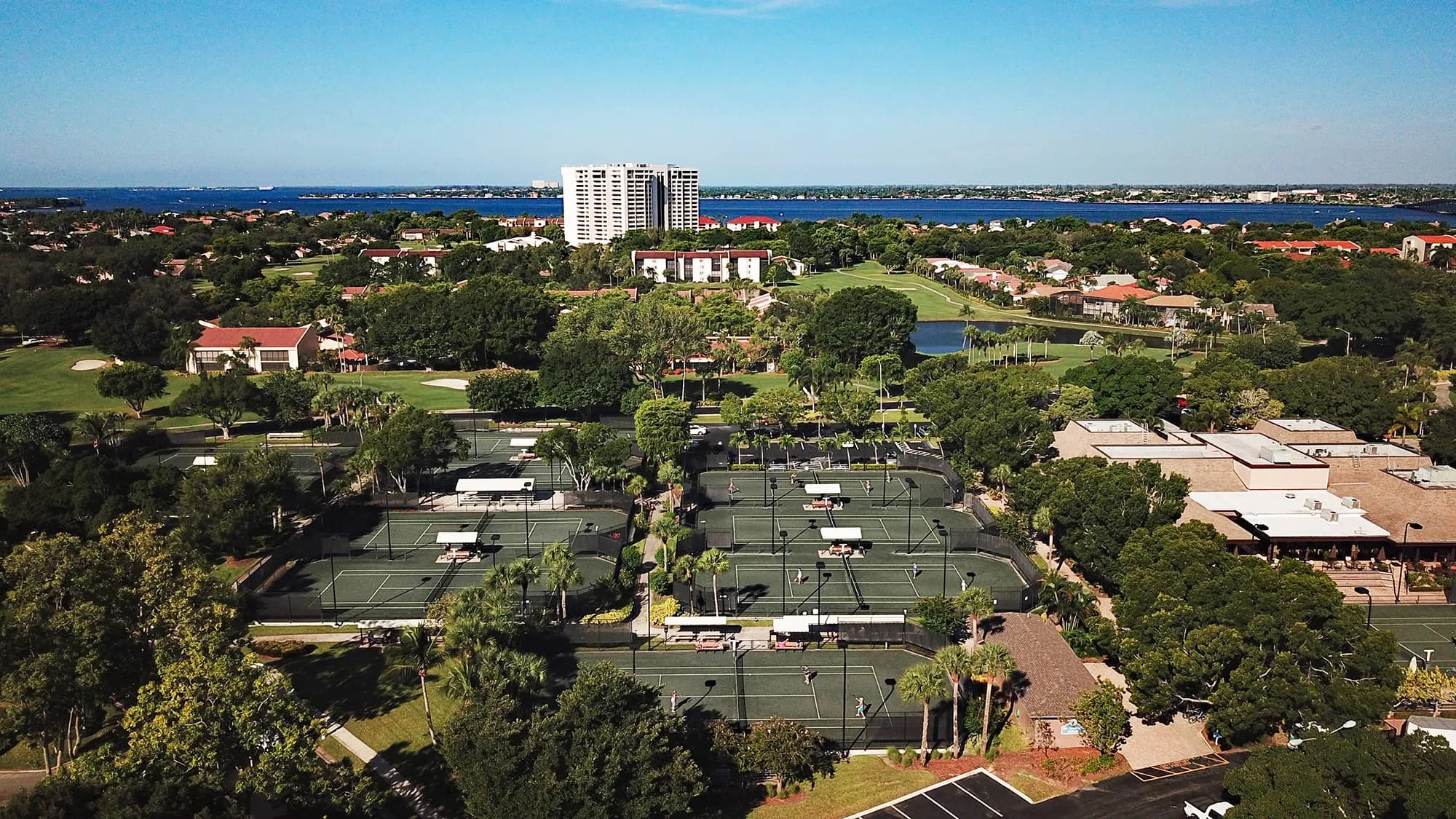 Tennis courts aerial surrounded by residences at The Landings (official).