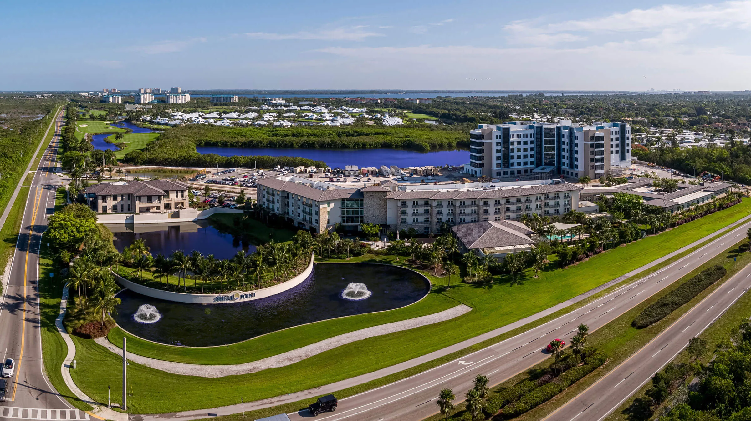 Waterside mid-rise residences overlooking fountain lake at Shell Point (official).