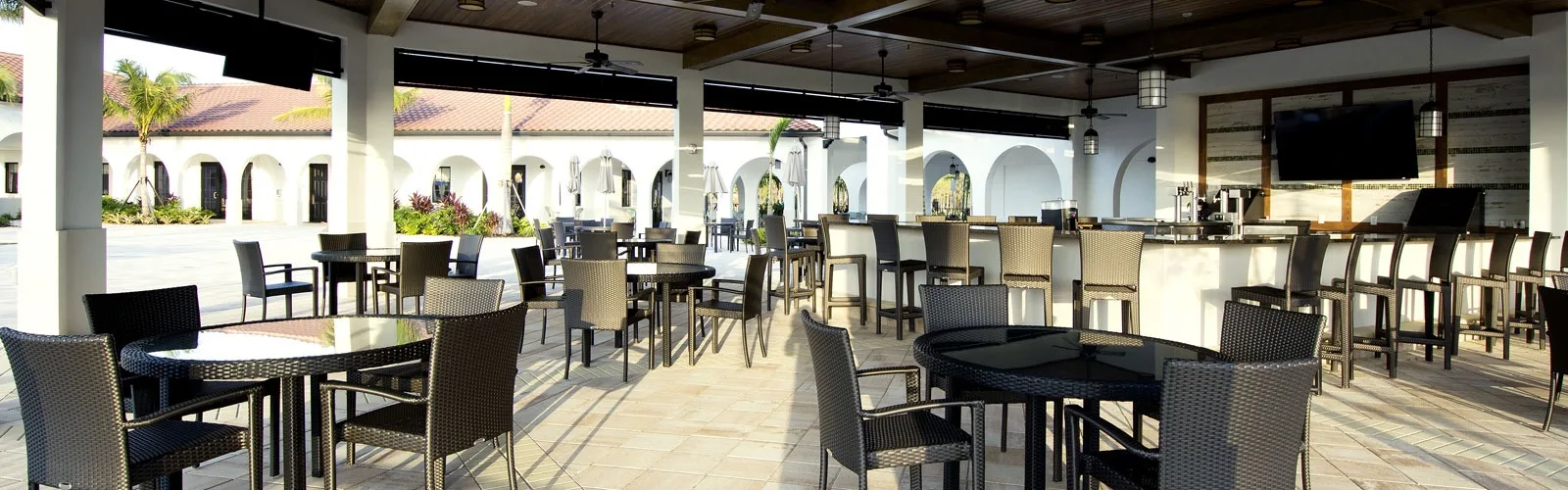 Covered outdoor bar and dining terrace at Arborwood Preserve, Fort Myers (official lifestyle site).