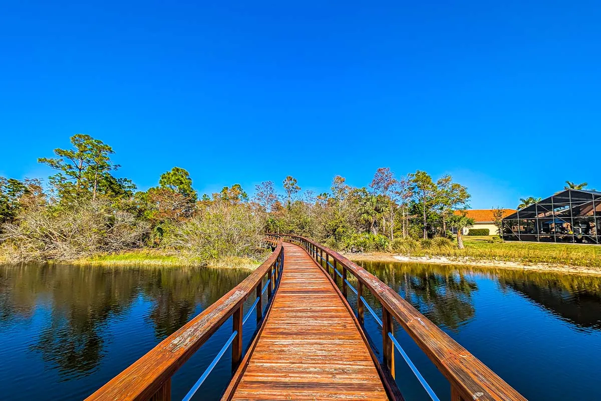 Community boardwalk over a lake at Belle Lago, Estero.