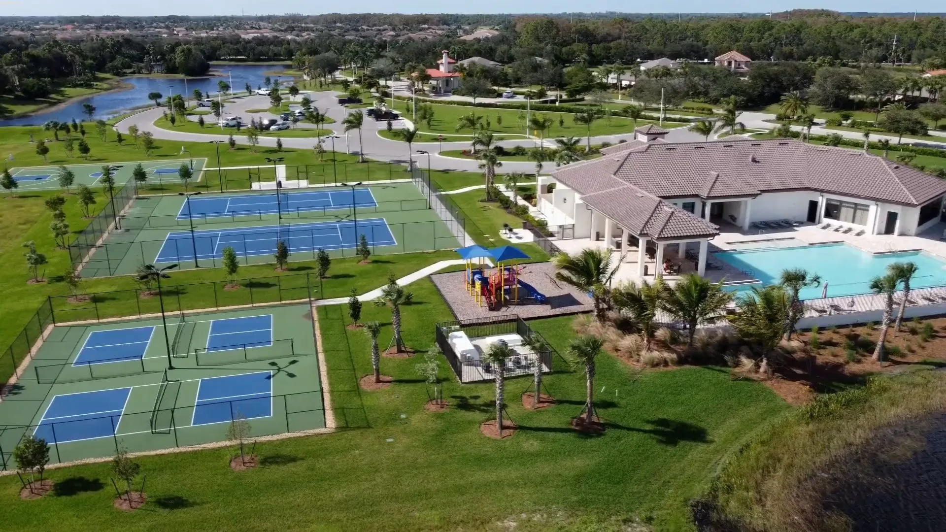 Aerial of the Portico clubhouse, pool and tennis and pickleball courts, Fort Myers (official Lennar site).