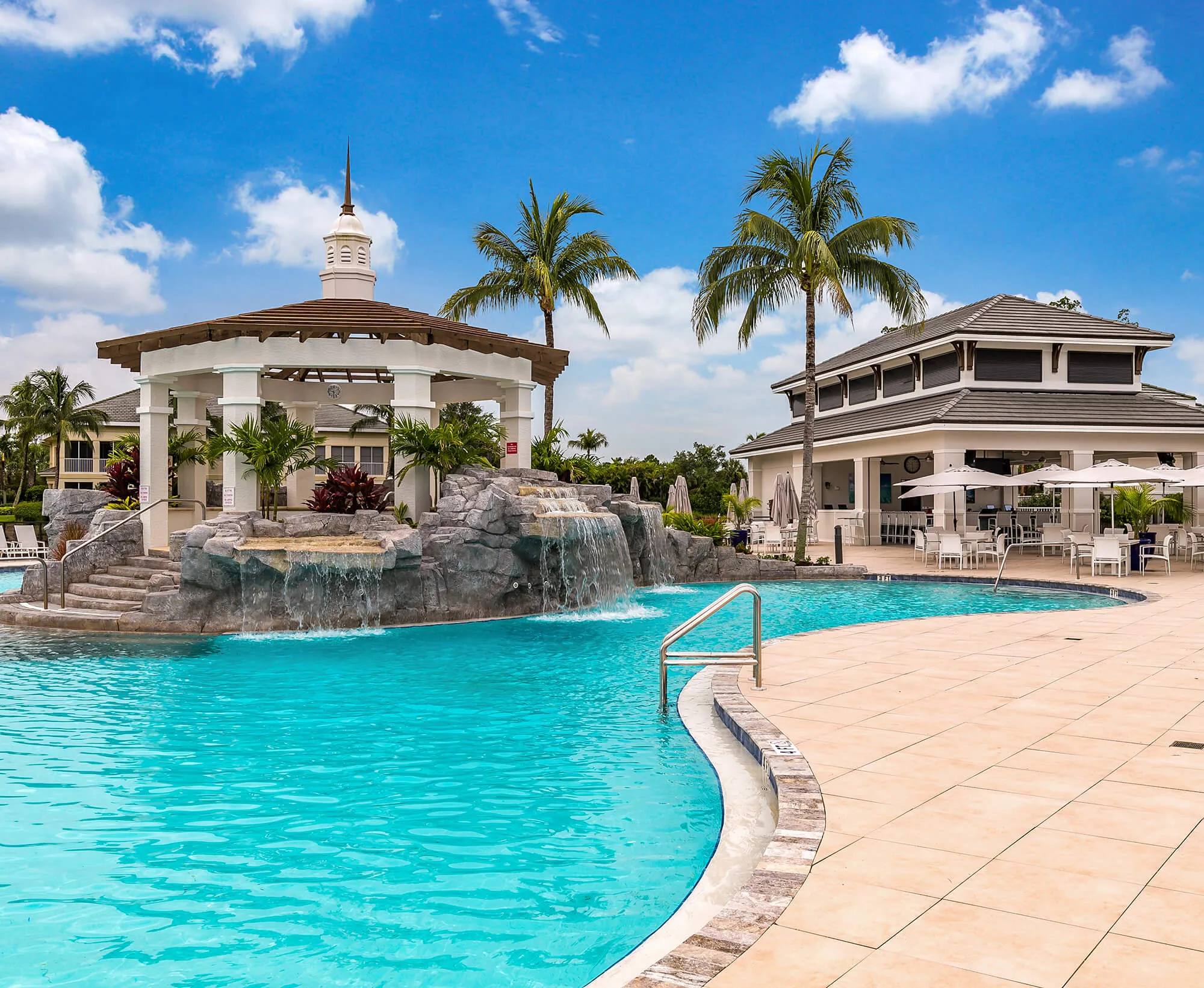 Pool with rock waterfall and pavilion at The Dunes of Naples.