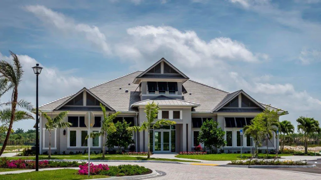 Flamingo Club clubhouse exterior at Antilles Naples (official developer site).