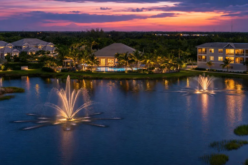 Twilight lake and residences at Antilles Naples (official developer site).