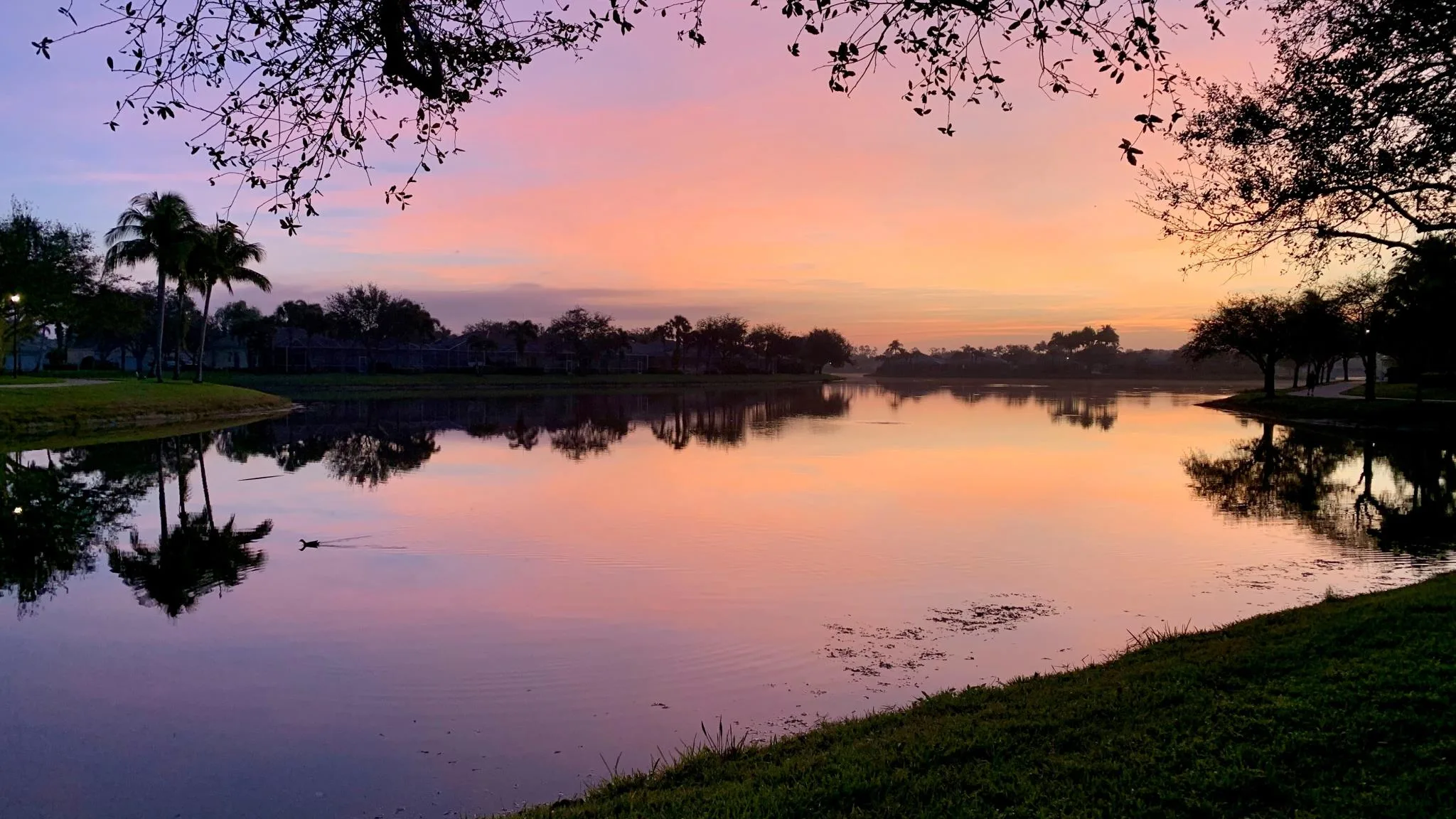 Sunset over one of the lakes at Island Walk, Naples.