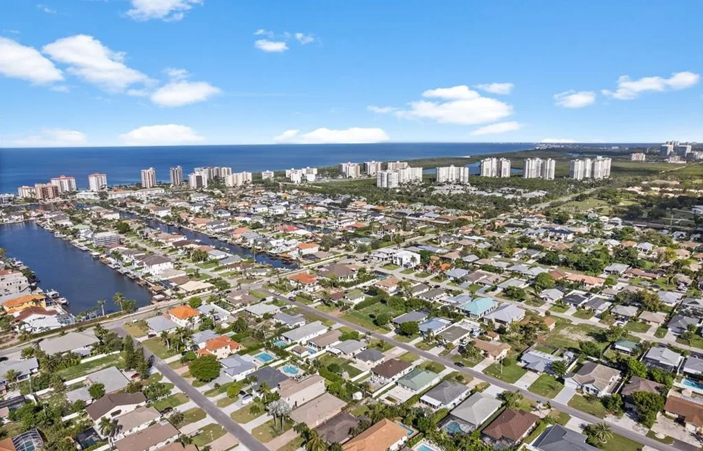 Naples Park aerial view with canals, homes and the Gulf