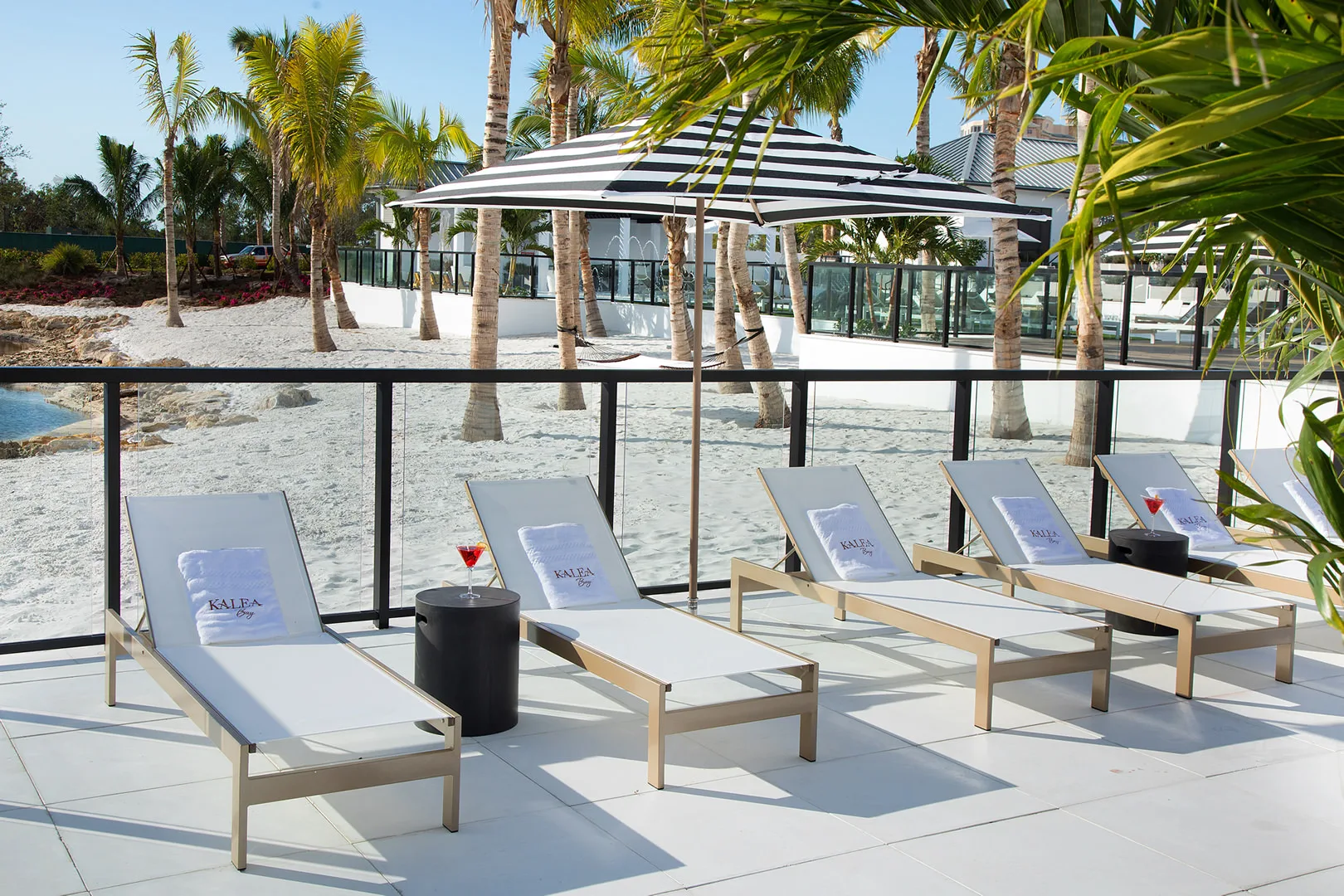 Poolside loungers at The Club at Kalea Bay